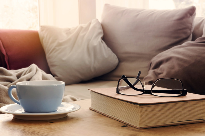 novel and a hot cup of coffee